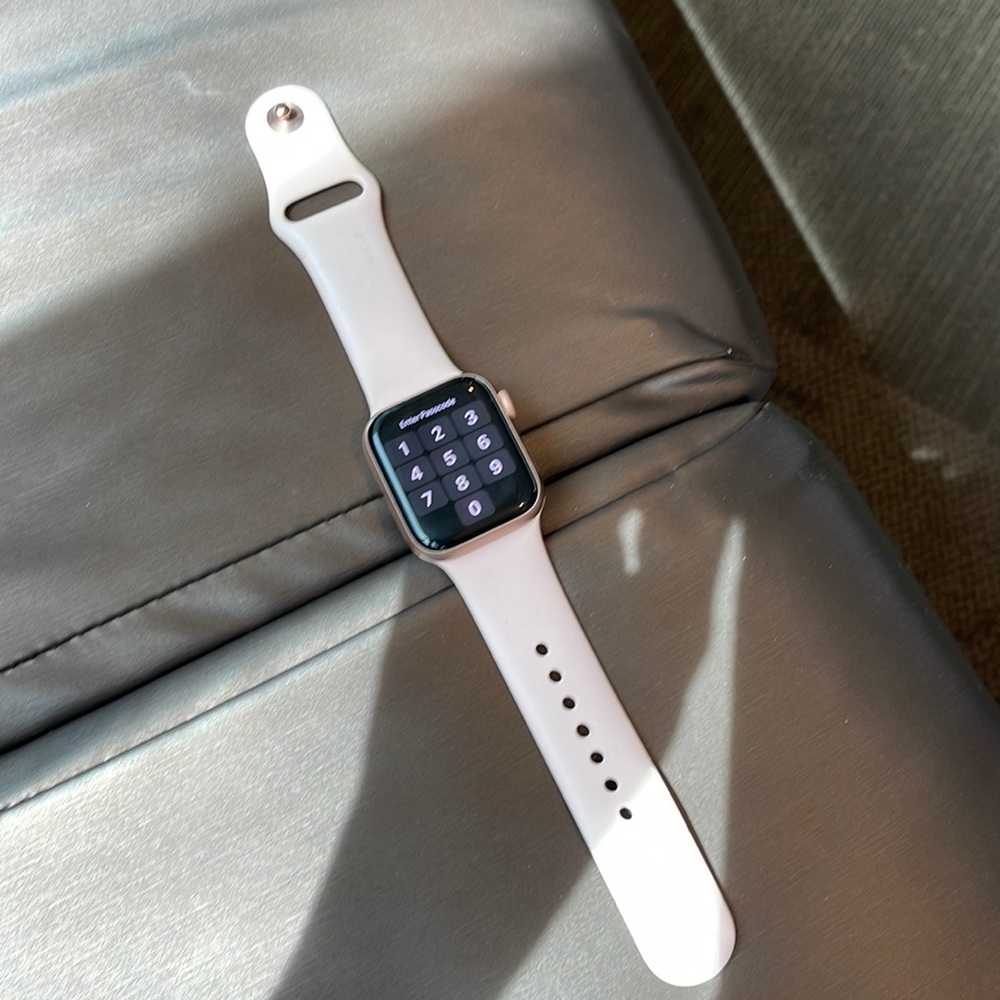 Apple 4 series watch with multiple bands. Face is rose gold cellular unlocked